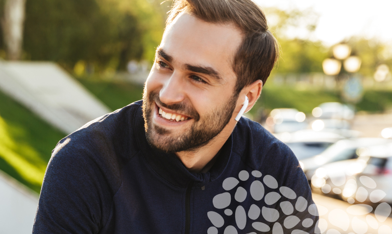 man listening to earbud