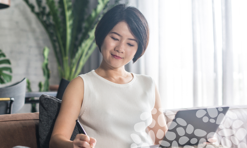 lady on laptop writing notes